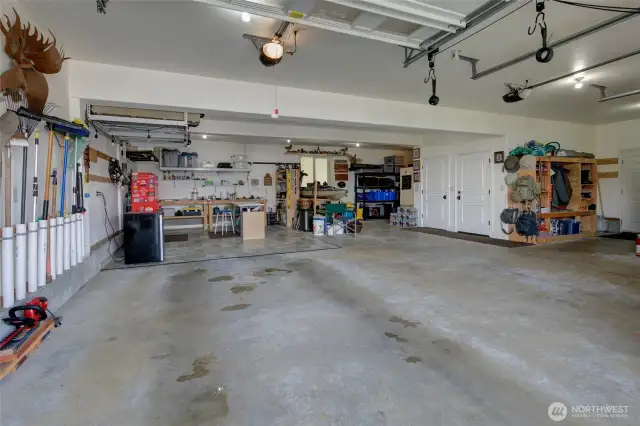 A quick peek inside this huge garage!  There is so much storage in here!!!!  And it's deep enough to fit 3+ vehicles, depending on their size!