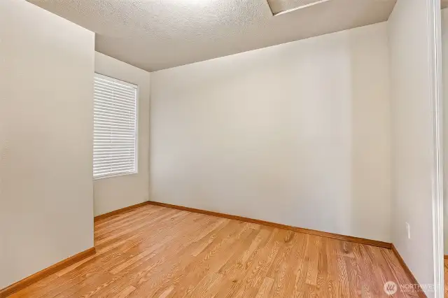 Light, bright, and laminate-floored, this bedroom keeps it simple in the best way. The wide slat blinds give you privacy when you want it and sunshine when you don’t. Guest room? Office? You decide.