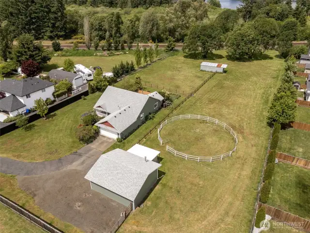 Your whole kingdom in one shot: workspace, play space, horse space, and a slice of lake life in the distance. This property doesn’t just have options , it has all the options.