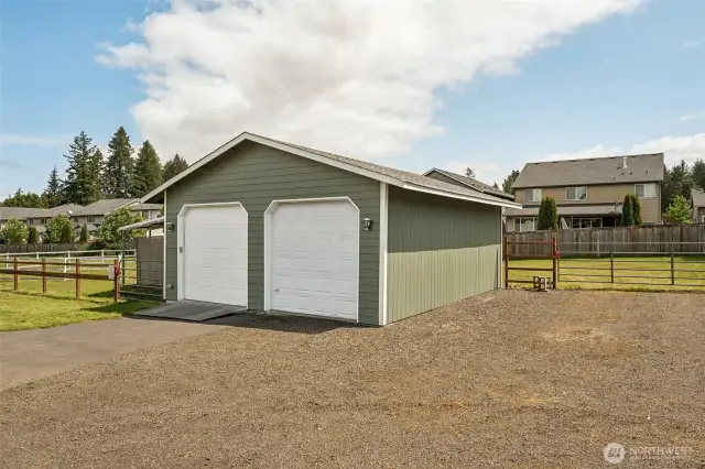 Shop goals unlocked: 10-year-old roof, fresh wiring, and a new covered patio ready for all your projects (or chill sessions). Gravel parking means space for all your toys, right next to the paved driveway.
