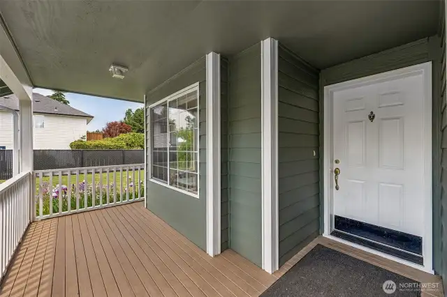 Covered front porch = instant curb appeal and the perfect spot for your seasonal decor dreams. That white 6-panel door with kickplate? Practical meets polished. Plus, the front living room window with pane inserts adds a subtle pop of character.