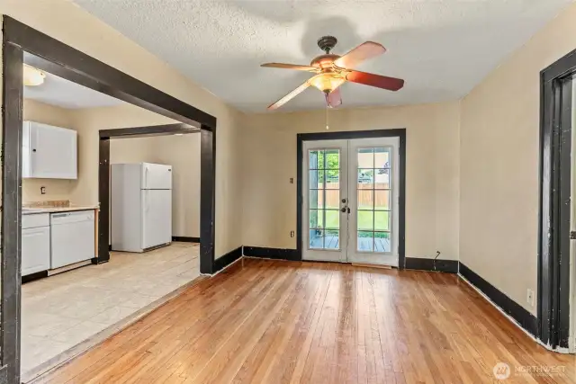 Dining room leads directly to kitchen for flow and accessibility.
