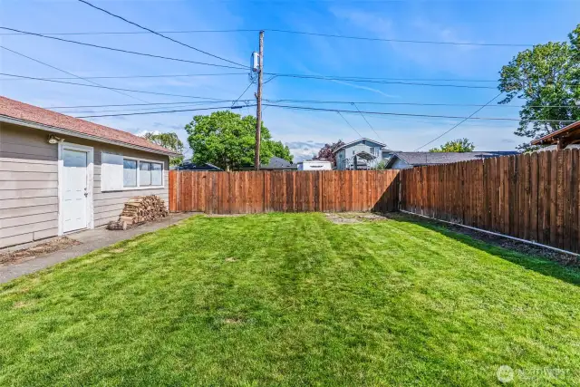 Spacious, fully fenced backyard.