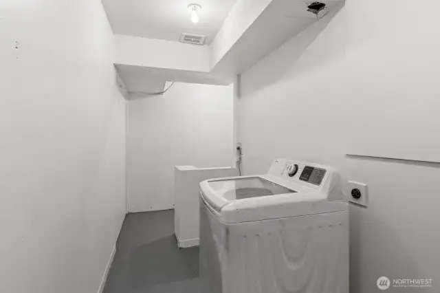 L shaped laundry and storage room just off the interior entrance of the unit. Washer and dryer hook ups inside.