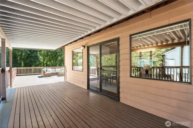 The deck is the center of both wings of the main floor, (no stairs to maneuver) AND makes it possible year-round to BBQ without getting rained . on