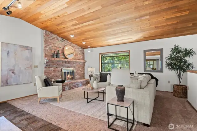 Family room features full wall 2nd wood burning masonry fireplace with built-in heat-o-later and garden window. Vaulted Cedar cathedral ceiling features ambiance lighting, wall space for the largest of Big Screen TVs, parquet dance floor and is adjacent to Primary Bedroom Suite space