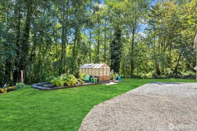 Gardner's delight! This 1 acre lot has a boarder around the garden with established raspberry bushes, veggie area, herbs and NEW wonderful garden shed for your year-round growing hobbies. There is large gravel parking for your overflow of visitors etc.