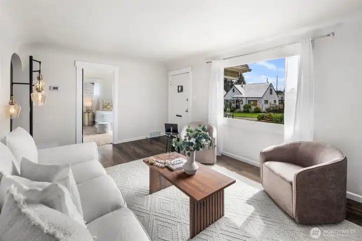Large picture windows frame the neighborhood while flooding the room with natural light, making it the true heart of the home.