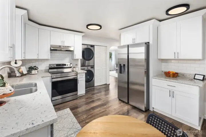 The seamless flow between cooking, dining, and storage creates a kitchen that feels as practical as it is inviting.