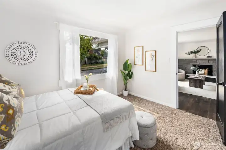 Steps from the living room, this front bedroom offers charm, convenience, and a peaceful view of the neighborhood.