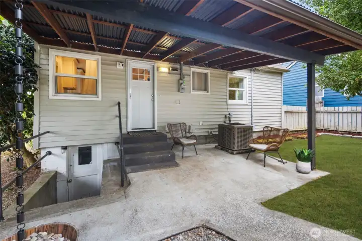 Covered patio just off the kitchen—ideal for morning coffee or hosting summer BBQs rain or shine.