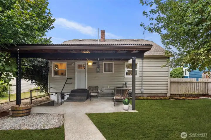 Step outside to this versatile covered patio and fenced yard, blending indoor comfort with outdoor living.