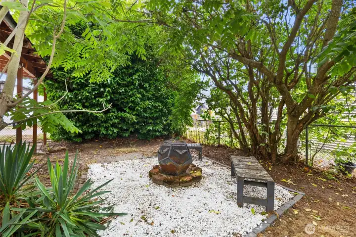 Gather with friends around the backyard fire pit, your own outdoor hangout spot.