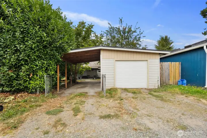 Detached garage with alley access makes parking and storage simple. Excellent DADU potential with garage and carport conversion.