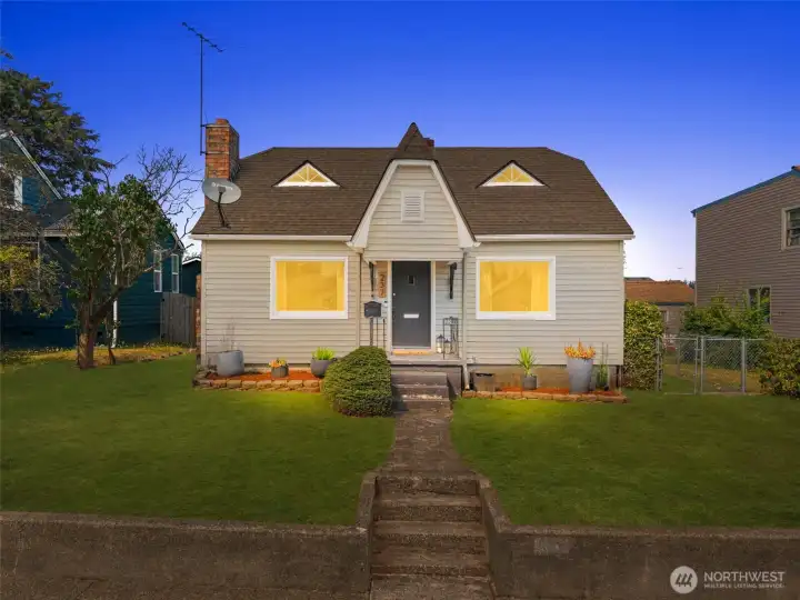 Evening glow highlights this home’s curb appeal, offering a picture-perfect first impression every time you come home.
