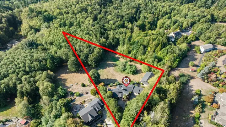 The spacious backyard includes a large fenced area, ideal for pets, play, or gardening. Every inch of the property has been curated for beauty and enjoyment.