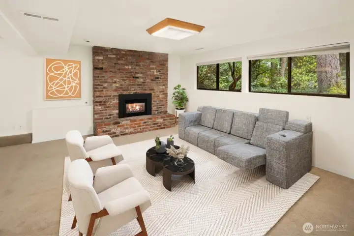 Lower level family room with gas fireplace.  Virtually staged.