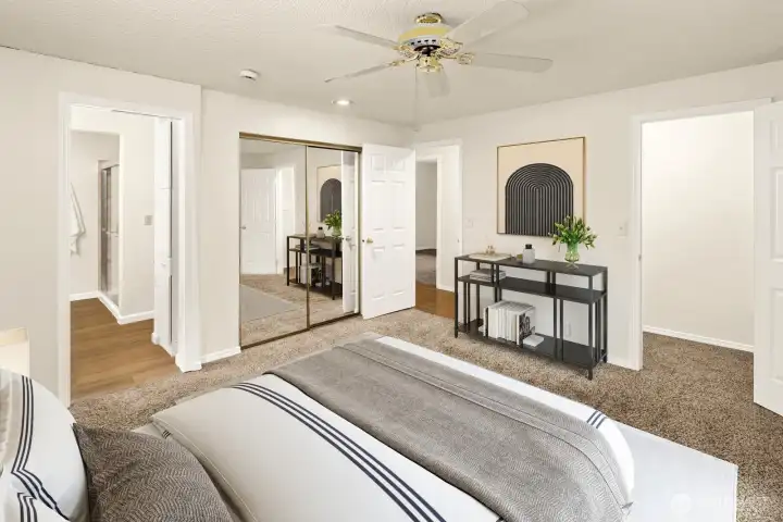 Primary bedroom with bathroom and walk-in shower. Virtually staged.