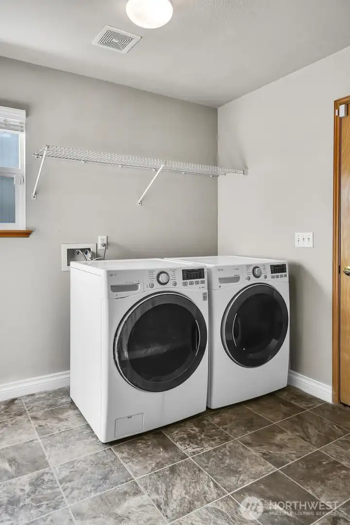 Laundry room with garage entrance on right