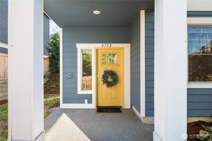 The covered patio leads to the front door and formal entry.