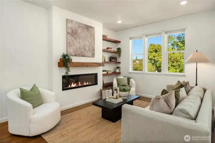The designer electric fireplace is nicely accented by the wood mantle and floating wood shelves.