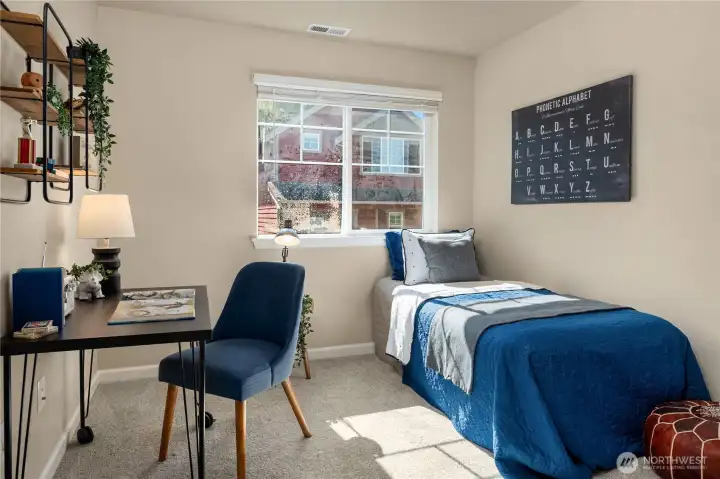 The third bedroom located on the upper floor is in addition to a bonus 4th bedroom located downstairs.