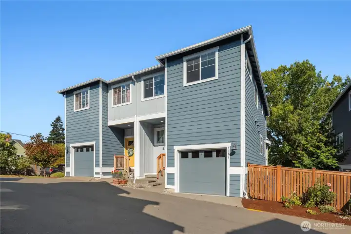 Looking from the south side and the attached one car garage with overhead storage.