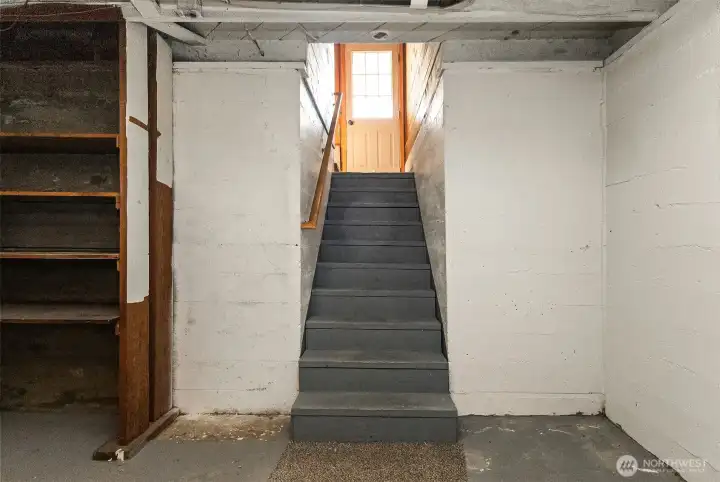 Downstairs to unfinished basement & laundry