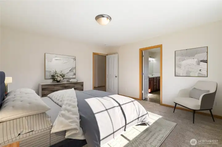 Virtually staged spacious primary looking towards ensuite