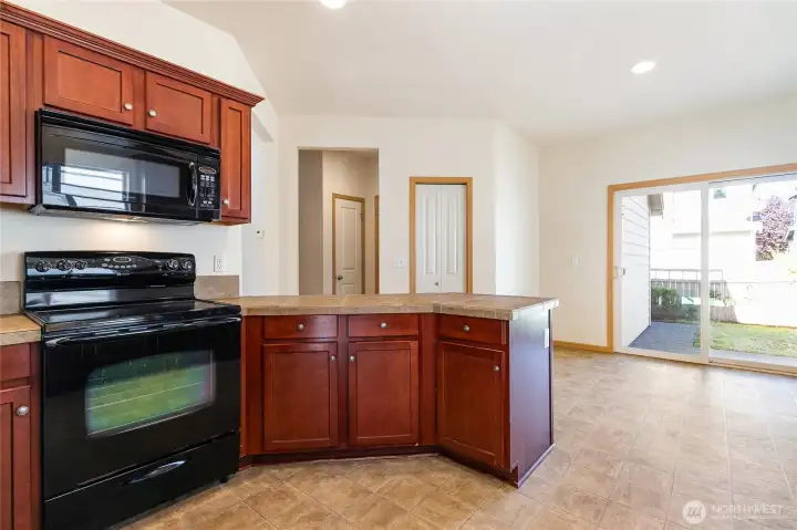 Kitchen looking towards dining area and backyard slider