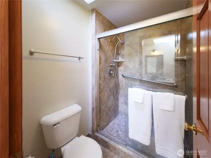 Master Walk In shower w/ floor to ceiling tile..Another Skylight