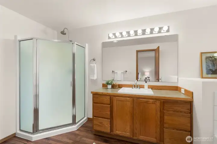 Primary bathroom with soaking tub and shower.