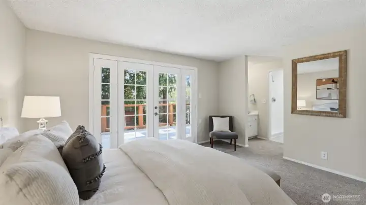 A calming primary bedroom with seamless access to the ensuite