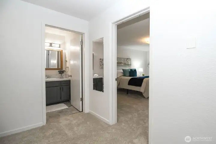 View into full bath and bedroom