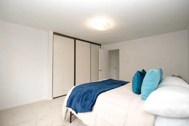 large triple door bedroom closet