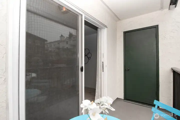 private patio with additional storage.  More storage on lower level of building