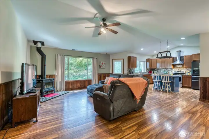 Open great room with vaulted ceilings and ceiling fan, comfortable space to gather with friends and family.