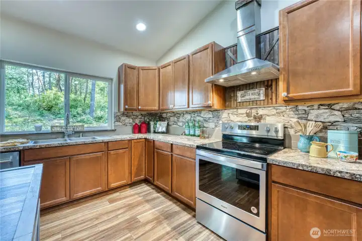 Newer custom hood vent installed make cooking a breeze.  Large windows allow an abundance of natural light.
