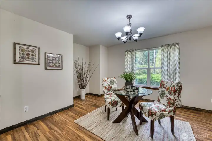 Dining room is convienantly located with beautiful hard surface flooring and lots of natural light.