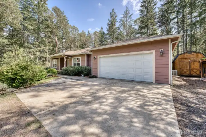 Large 2 car garage with pleanty of parking on the driveway as well as to the side and a huge storage shed as well.