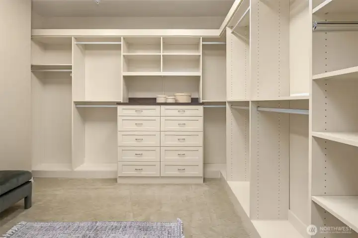 Primary walk-in closet. Primary walk-in closet.