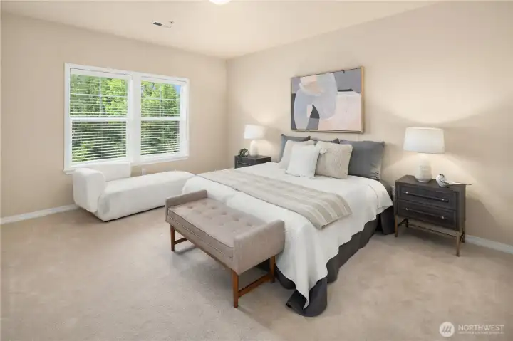 Primary suite is spacious and bright.