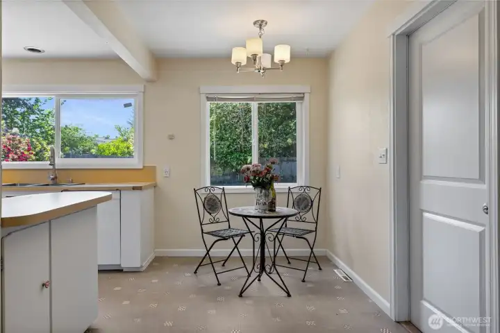A cozy dining area in the kitchen can easily house a table bigger than the staged table (this is real furniture).