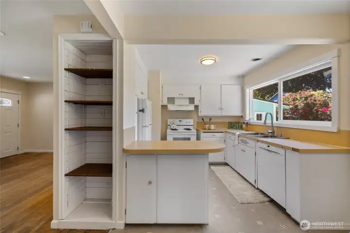 There is generous cabinetry and a big window inviting natural sunlight