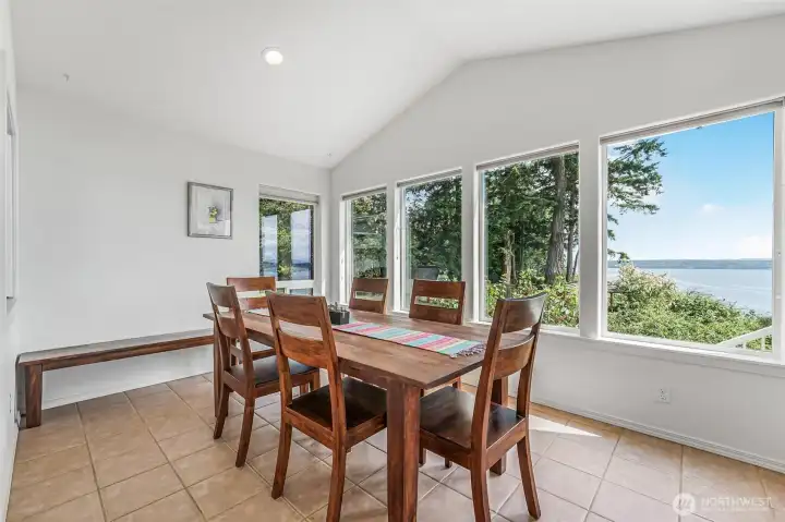 The dining room is wrapped in windows to maximize the view.