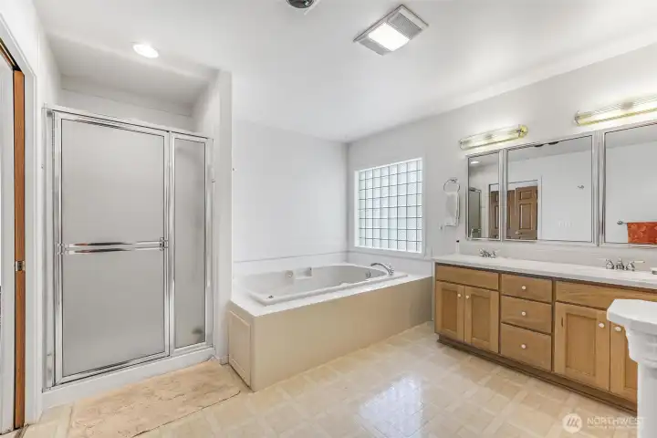 Relax in the oversized jetted tub in the primary suite ensuite.
