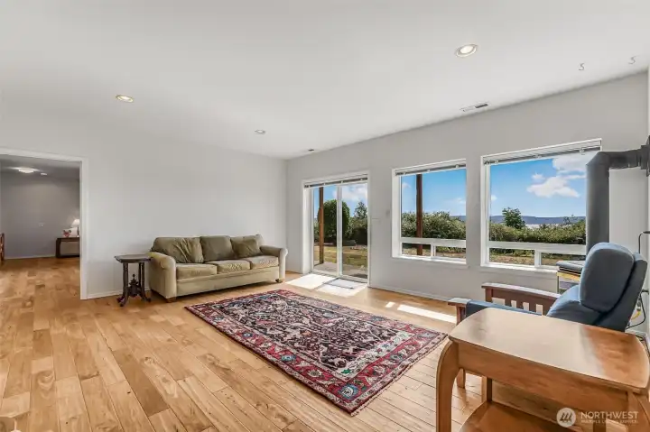 The versatile lower level is complete with 2 additional bedrooms, a full bathroom, a secondary living area, a theater room/office/flex space plus access to the outdoors.
