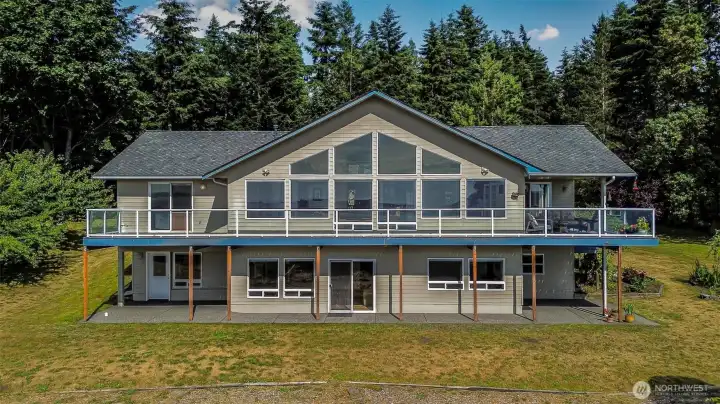 The home from the back.  Look at all of those windows!