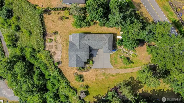 The 1+ acre grounds features an orchard with many different fruit trees and mature landscaping full of colorful perennials.