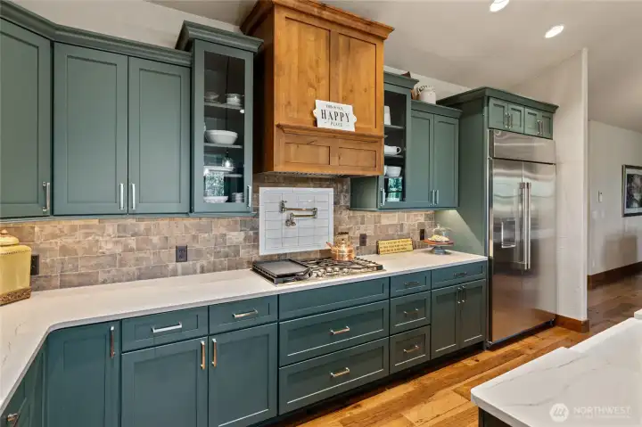 Full backsplash and pot filler.